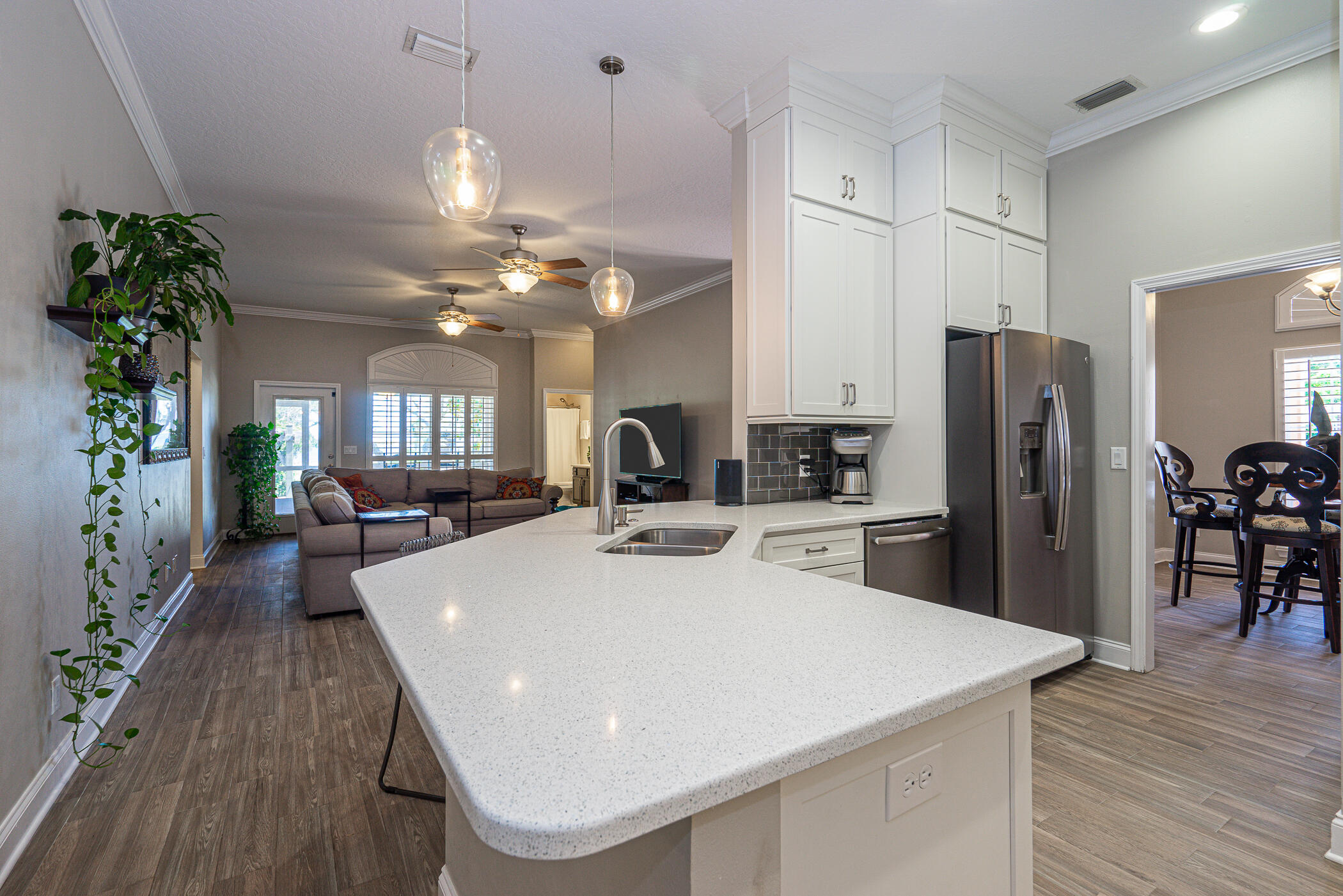 569 Radiant Circle Mary Esther, FL 32569 - Photo 36 of 42 a kitchen with a table chairs refrigerator and microwave