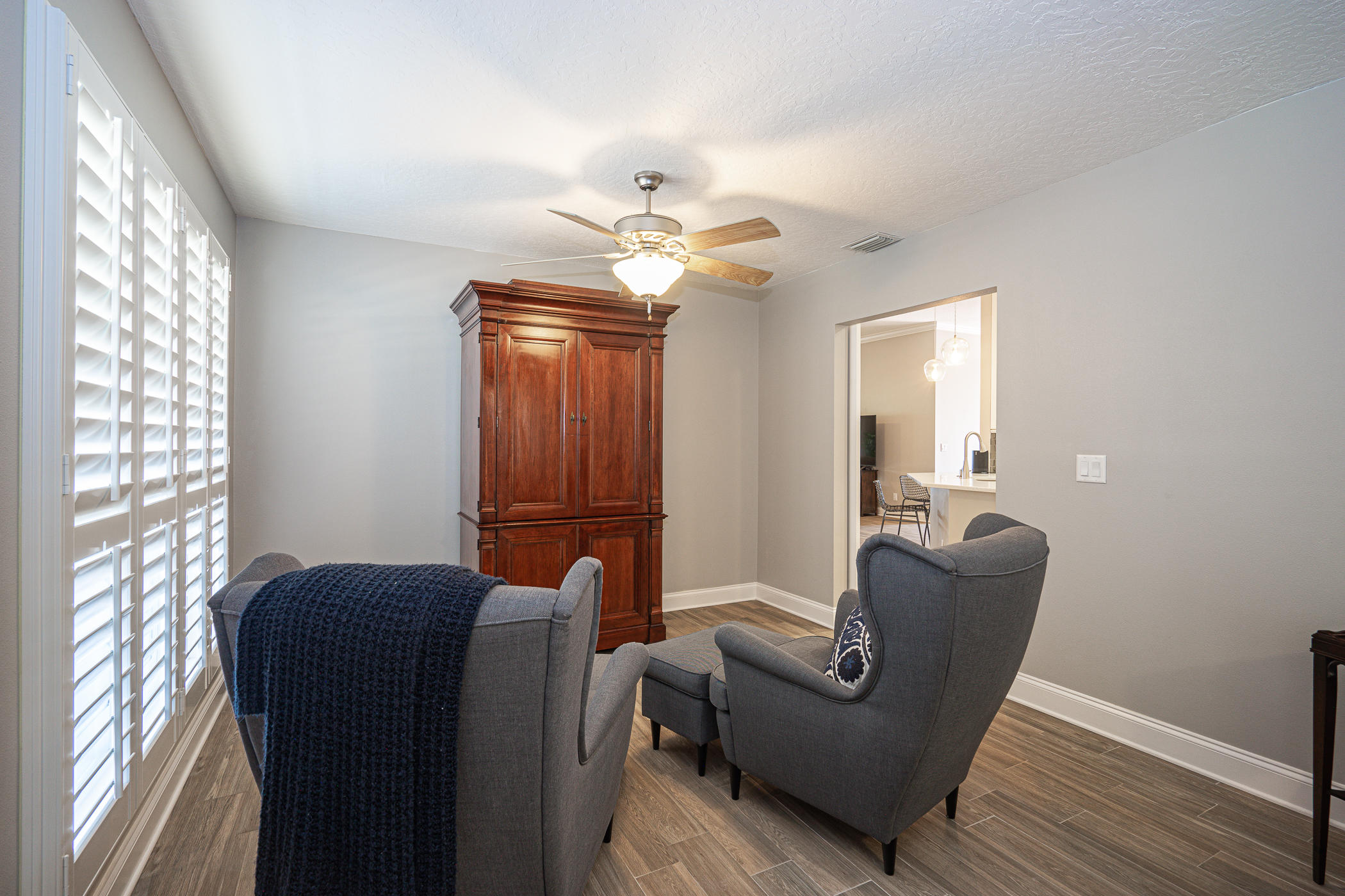 569 Radiant Circle Mary Esther, FL 32569 - Photo 39 of 42 a living room with furniture and a chandelier