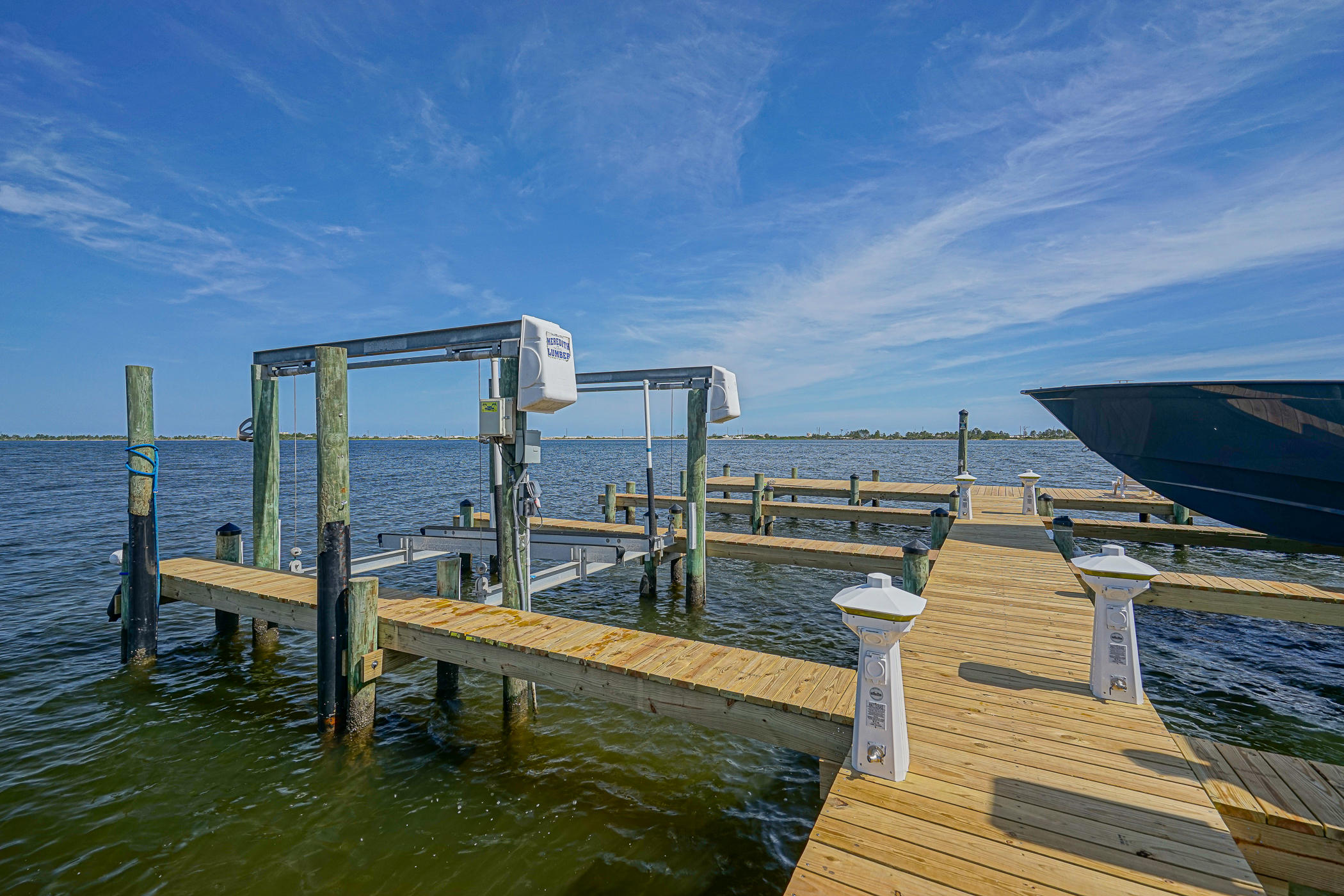569 Radiant Circle Mary Esther, FL 32569 - Photo 5 of 42 a roof deck with table and chairs a barbeque