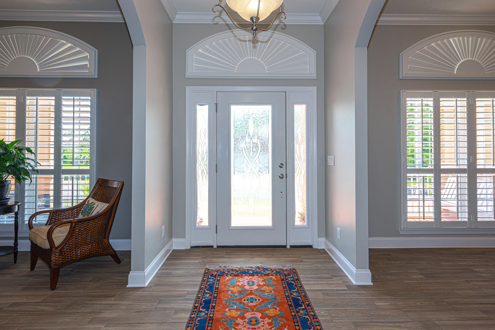 569 Radiant Circle Mary Esther, FL 32569 - Photo 6 of 42 a view of an entryway with wooden floor and a rug