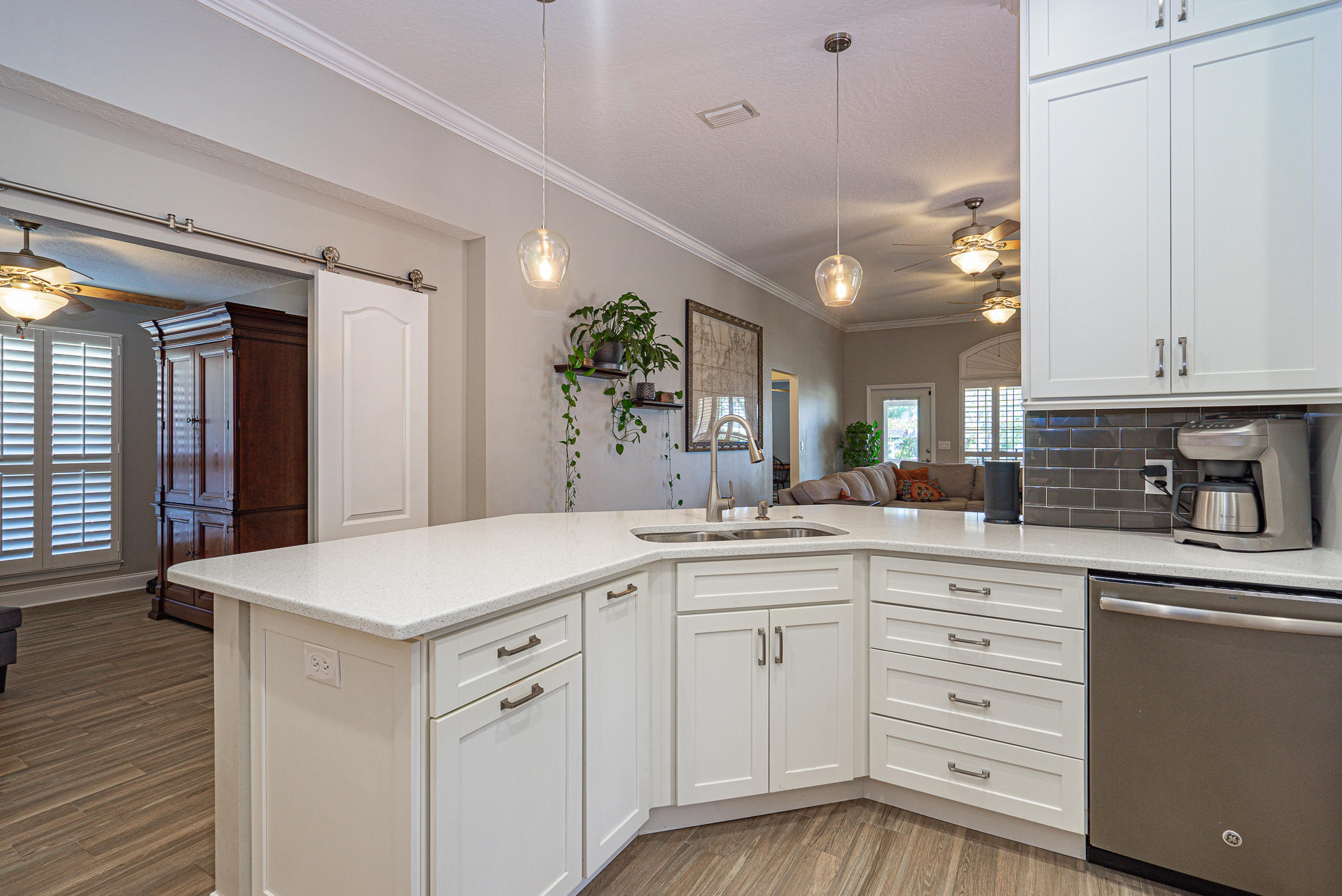569 Radiant Circle Mary Esther, FL 32569 - Photo 8 of 42 a kitchen with white cabinets and sink