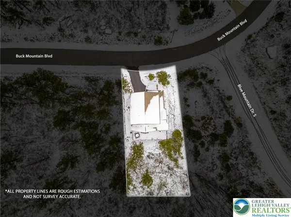 a view of living room filled with furniture and a window