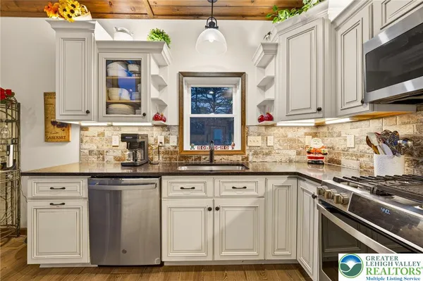 a very nice looking dining room with a large window