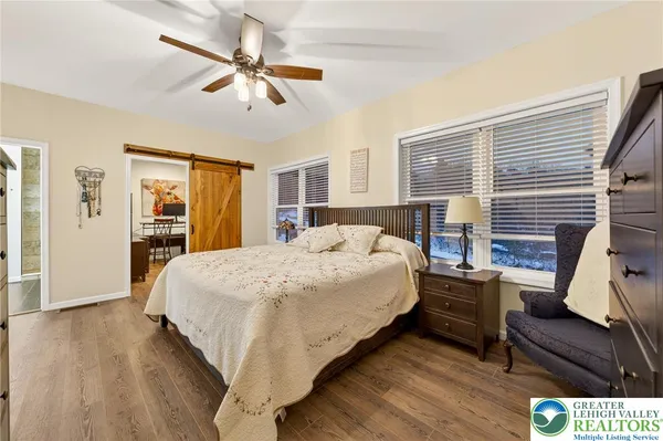 a view of a patio with a table and chairs and wooden floor