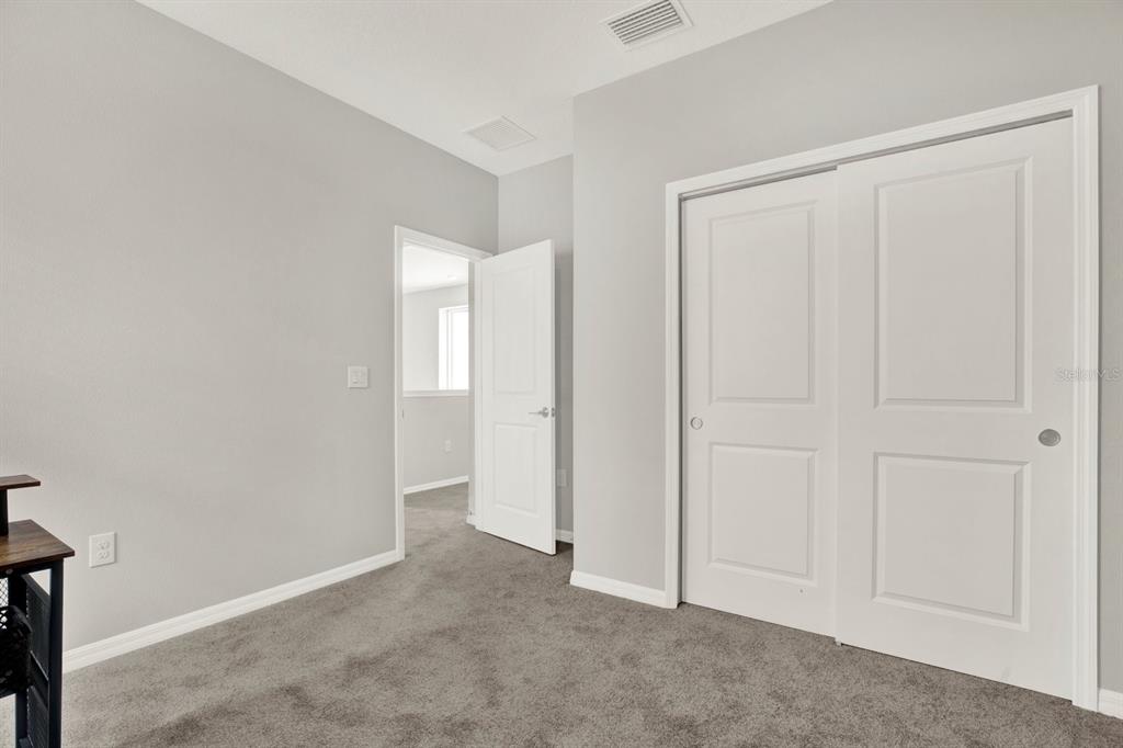 13729 Rangeland Boulevard Odessa, FL 33556 - Photo 14 of 30 a view of an empty room and closet area
