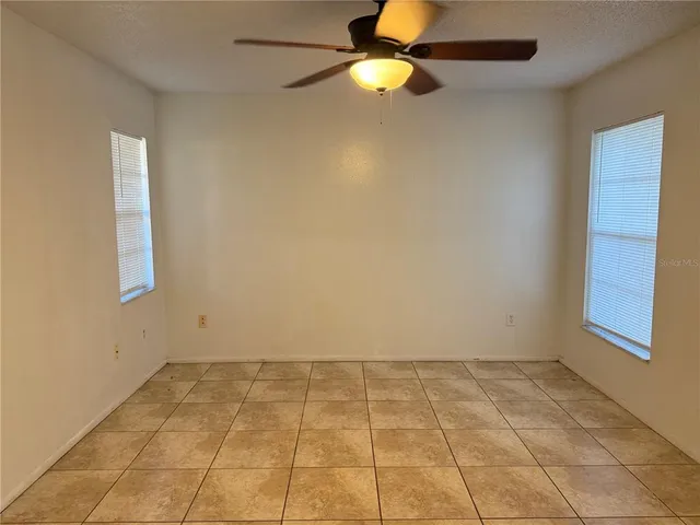 a view of a room with large windows