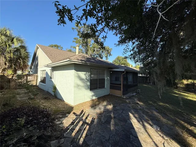 a backyard of a house with lots of green space