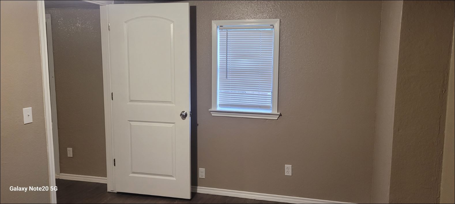 349 State Highway 95 Elgin, TX 78621 - Photo 16 of 16 Unfurnished room with baseboards and dark wood-type flooring