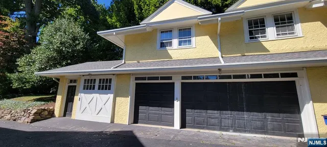 a view of a house with a door and wooden floor