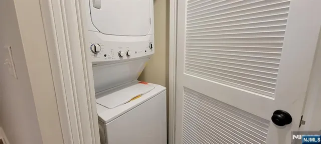 a bathroom with a toilet and a shower curtain