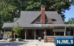 a view of a house with entrance gate