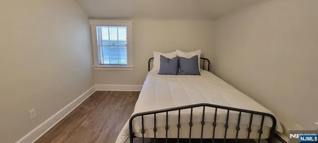 a balcony view with wooden floor and a window