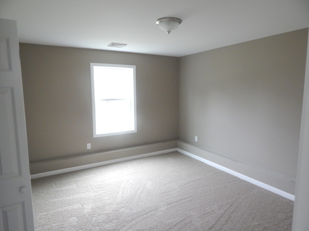 57 Frederick Street Fall River, MA 02721 - Photo 12 of 13 an empty room with a window