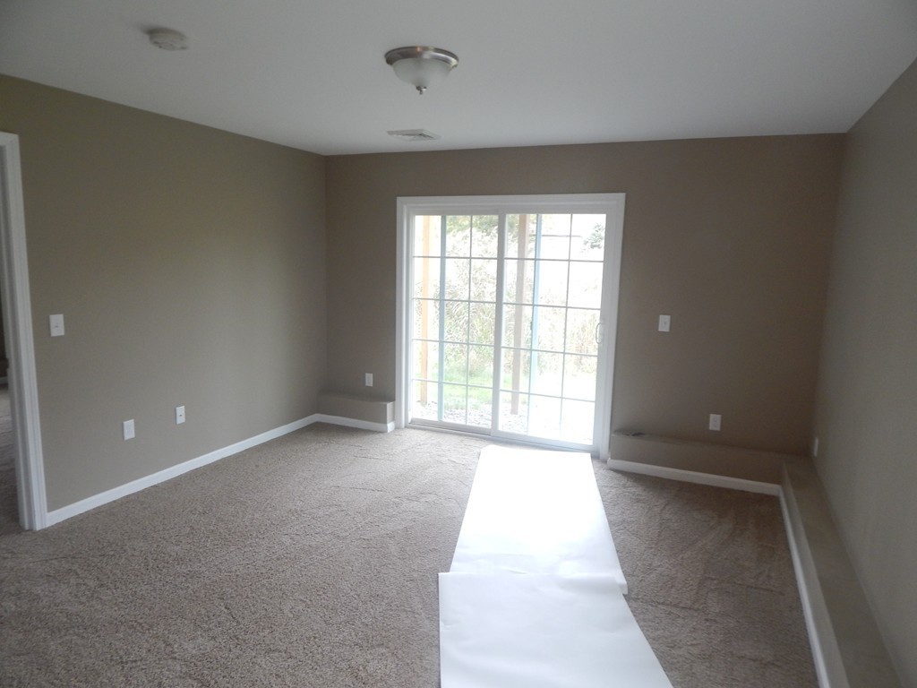 57 Frederick Street Fall River, MA 02721 - Photo 13 of 13 a view of an empty room with a window