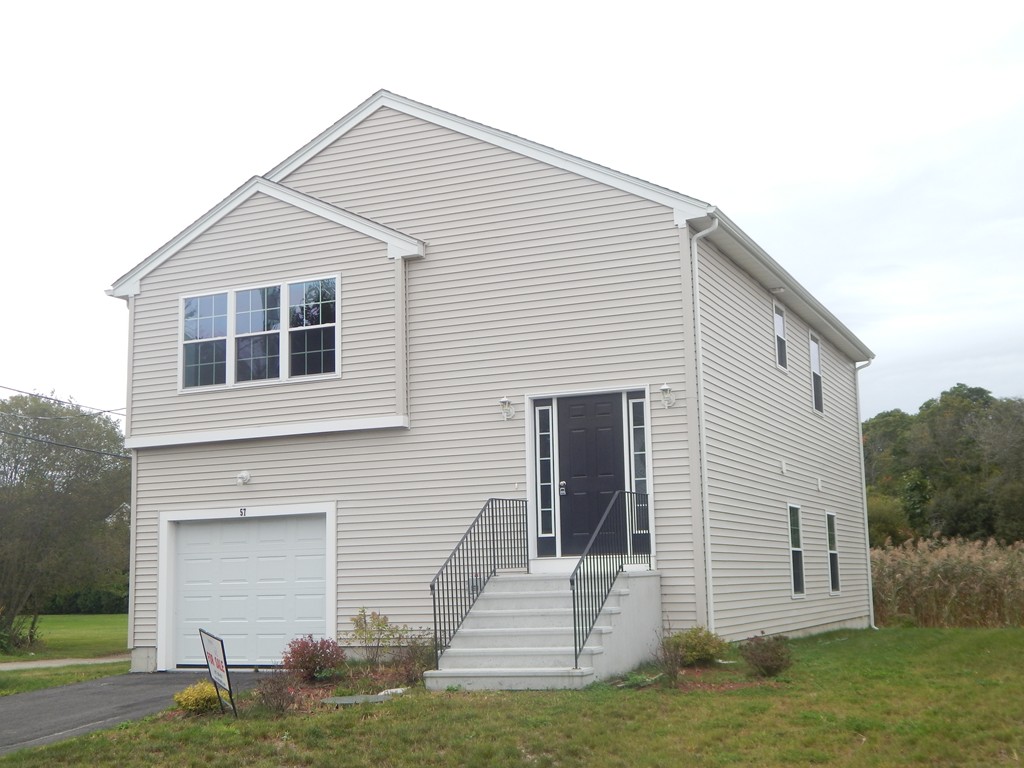57 Frederick Street Fall River, MA 02721 - Photo 2 of 13 a view of a house with a yard