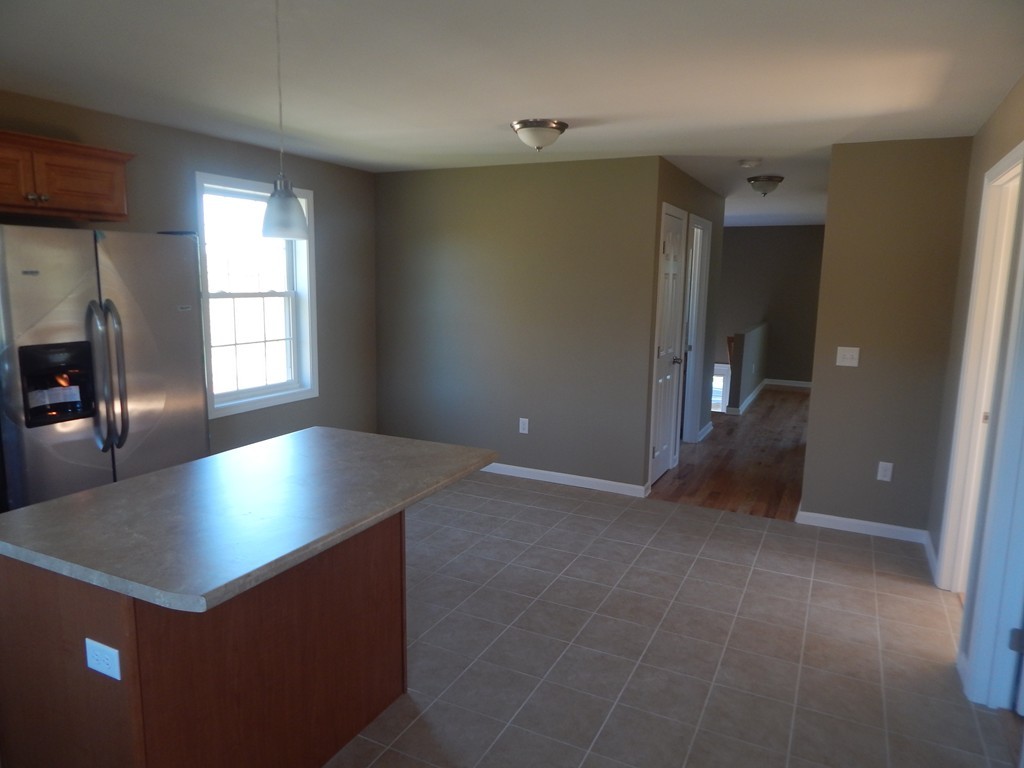 57 Frederick Street Fall River, MA 02721 - Photo 6 of 13 an empty room with closet and windows