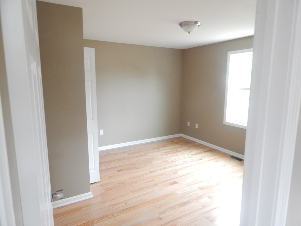 57 Frederick Street Fall River, MA 02721 - Photo 9 of 13 a view of empty room with wooden floor