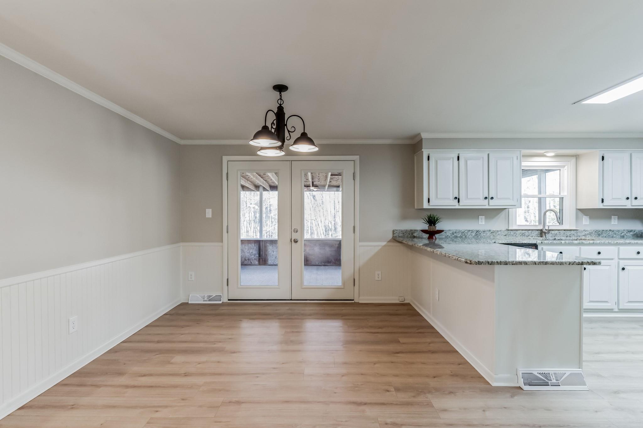 444 Culler Road Pinnacle, NC 27043 - Photo 8 of 34 a view of a kitchen with a sink cabinets and wooden floor
