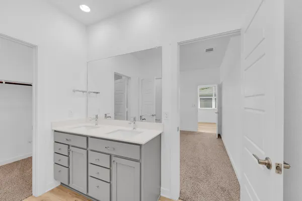 a bathroom with a shower and sink