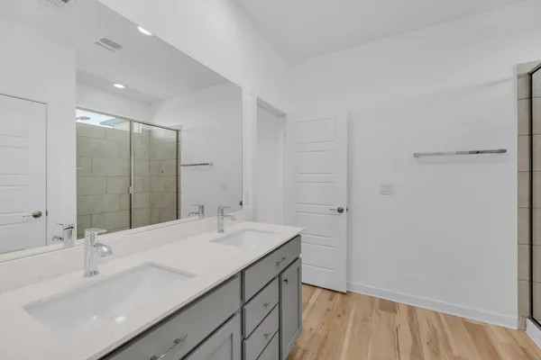 a bathroom with a sink a vanity and a mirror