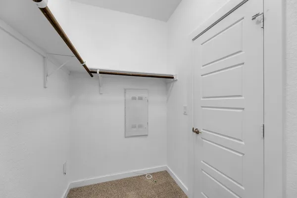 a view of a storage & utility room with wooden floor