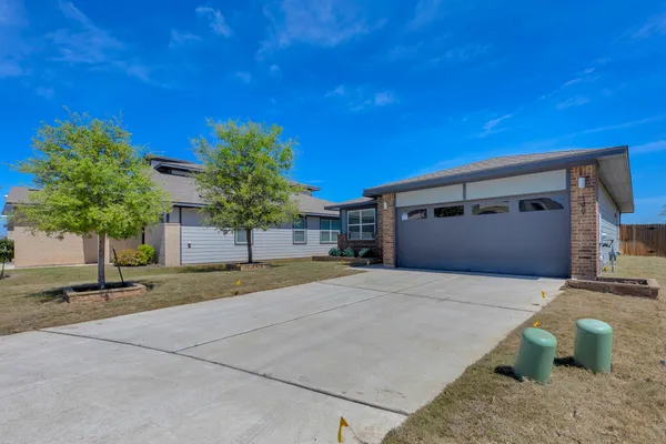 a house view with a backyard space