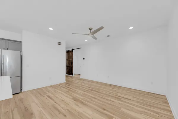 a view of kitchen with refrigerator sink and stove