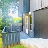 a view of balcony with wooden floor