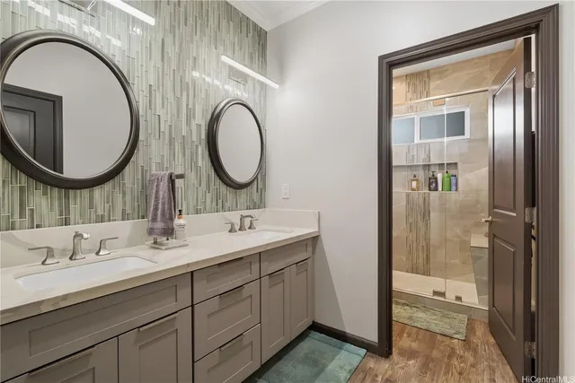 a bathroom with a double vanity sink and a mirror
