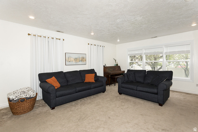 7797 North Windhover Road Eagle Mountain, UT 84005 - Photo 6 of 33 Spacious interior room featuring carpeted flooring, light-toned walls, and recessed lighting
