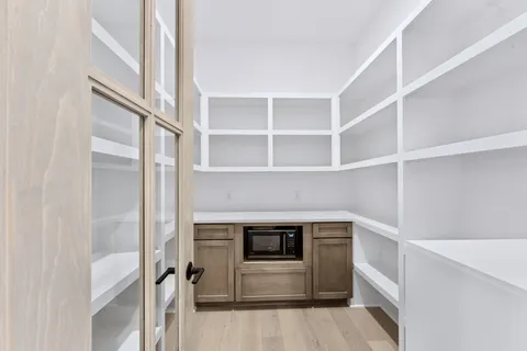 a kitchen with cabinets and stainless steel appliances