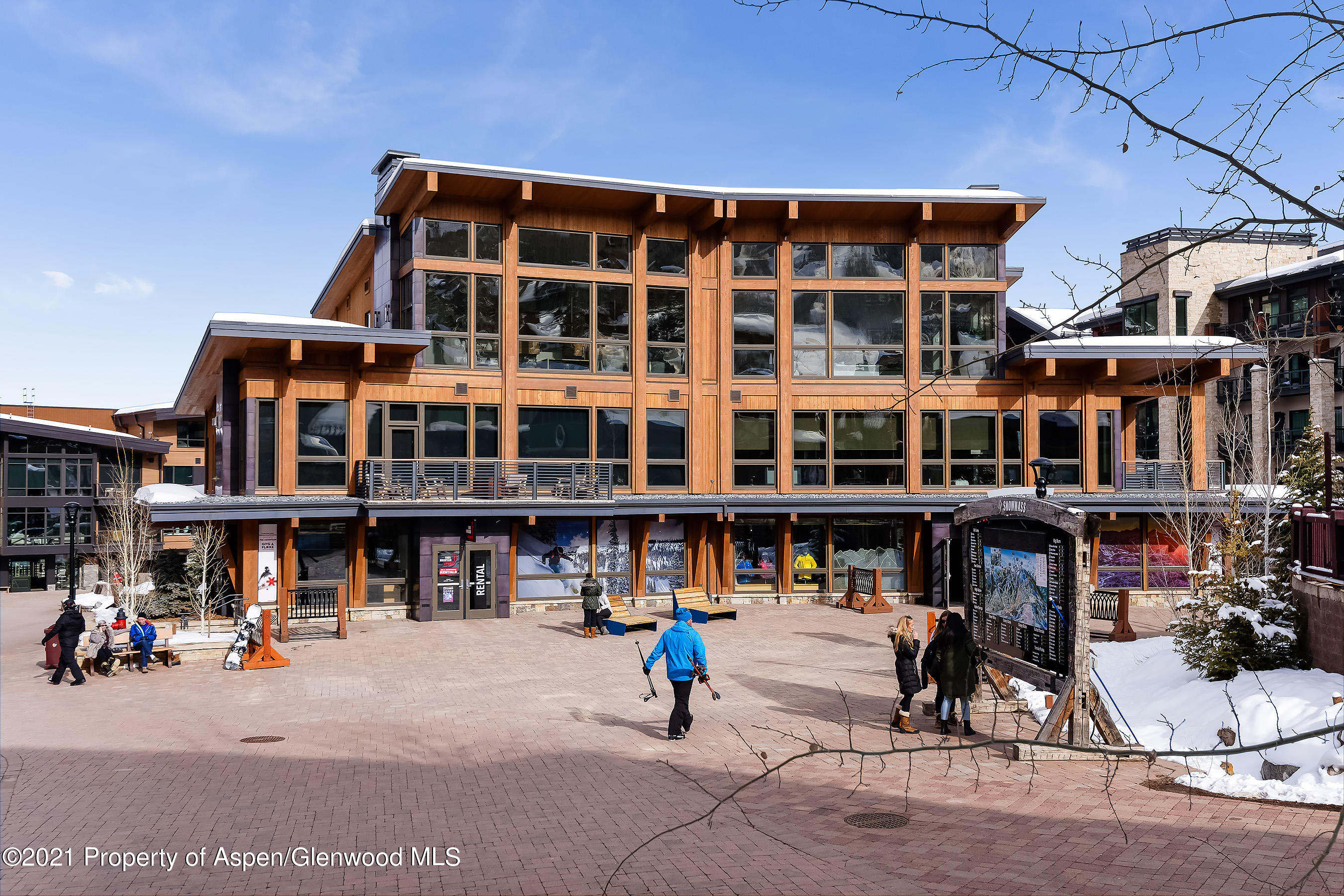 61 Wood Road, Unit R1 Snowmass Village, CO 81615 - Photo 1 of 1 a street view with tall buildings