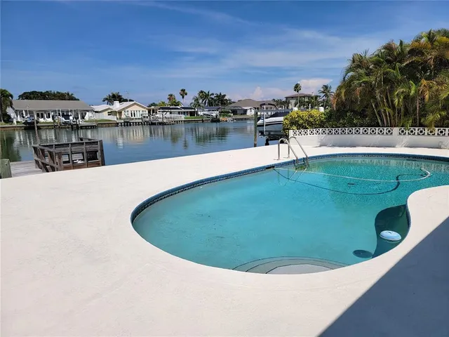 a view of a swimming pool with a lake