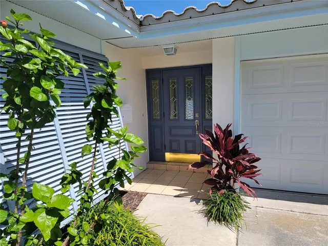 a vase with flowers sitting on a floor