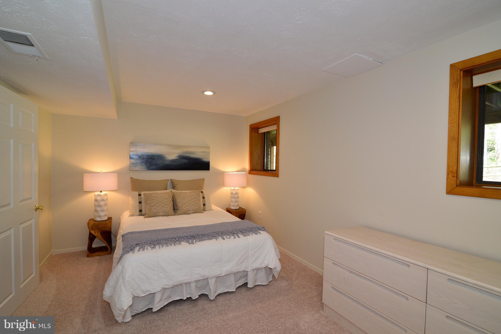 2203 Spinnaker Court Reston, VA 20191 - Photo 26 of 30 a bedroom with a bed and a night stand