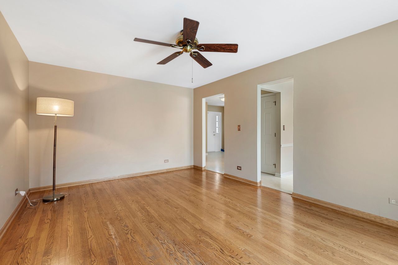 681 Randi Lane Hoffman Estates, IL 60169 - Photo 12 of 33 wooden floor in an empty room