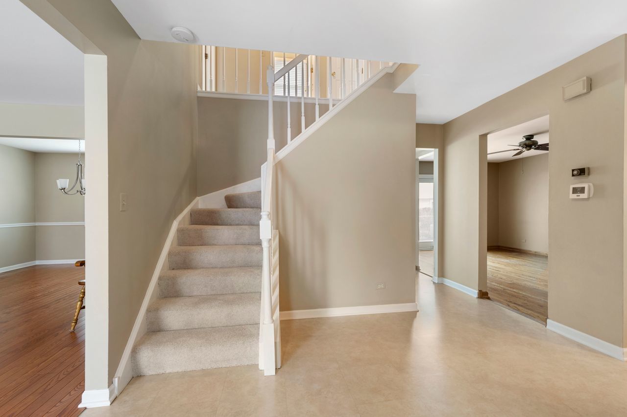 681 Randi Lane Hoffman Estates, IL 60169 - Photo 16 of 33 a view of entryway and hall with wooden floor