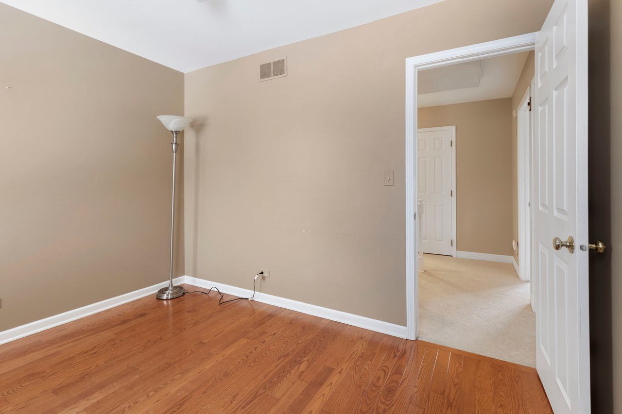 681 Randi Lane Hoffman Estates, IL 60169 - Photo 20 of 33 wooden floor in an empty room