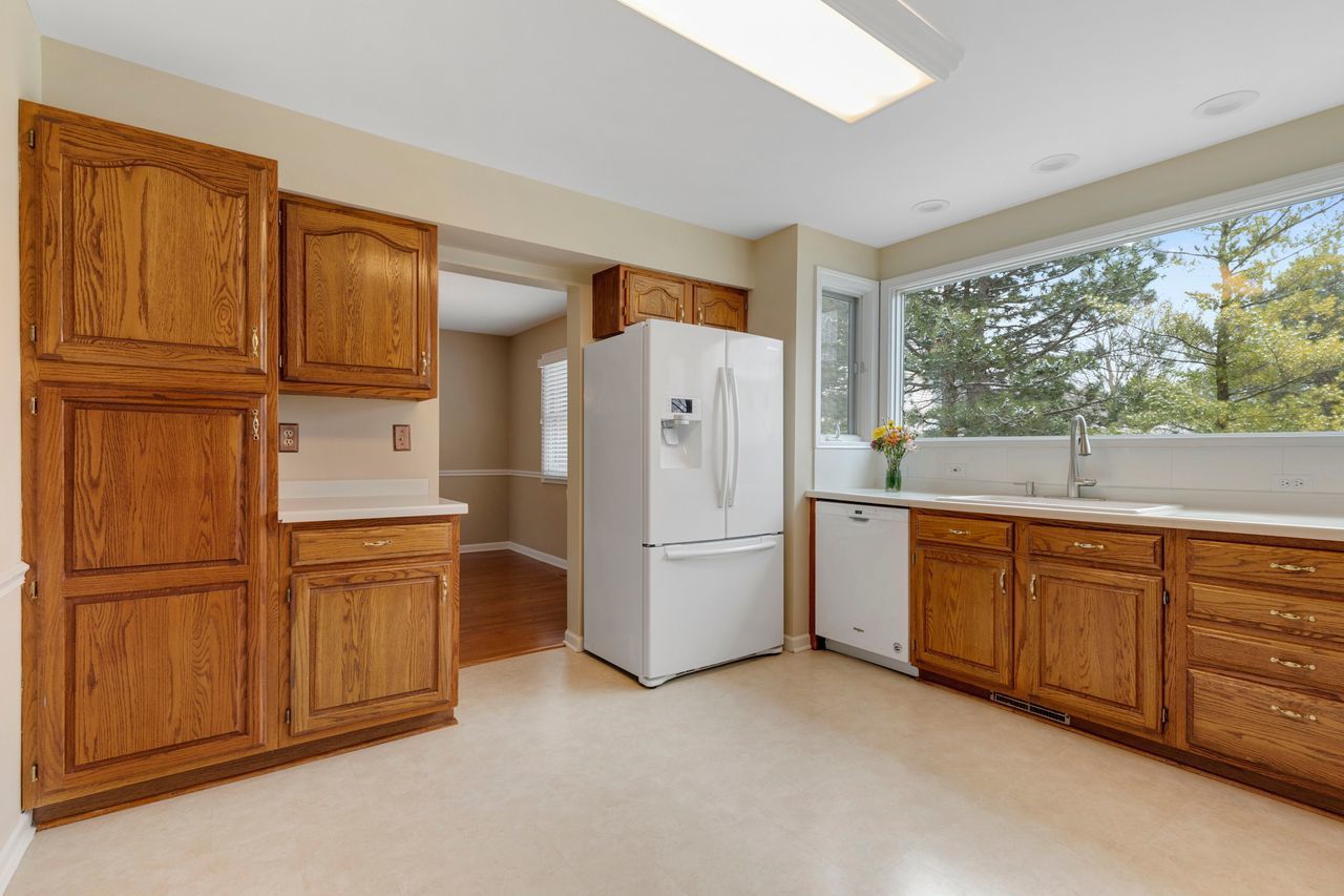 681 Randi Lane Hoffman Estates, IL 60169 - Photo 5 of 33 a kitchen with stainless steel appliances granite countertop a refrigerator and a sink