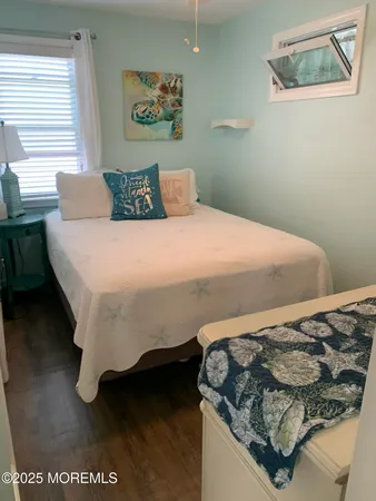 a bedroom with a bed and a table
