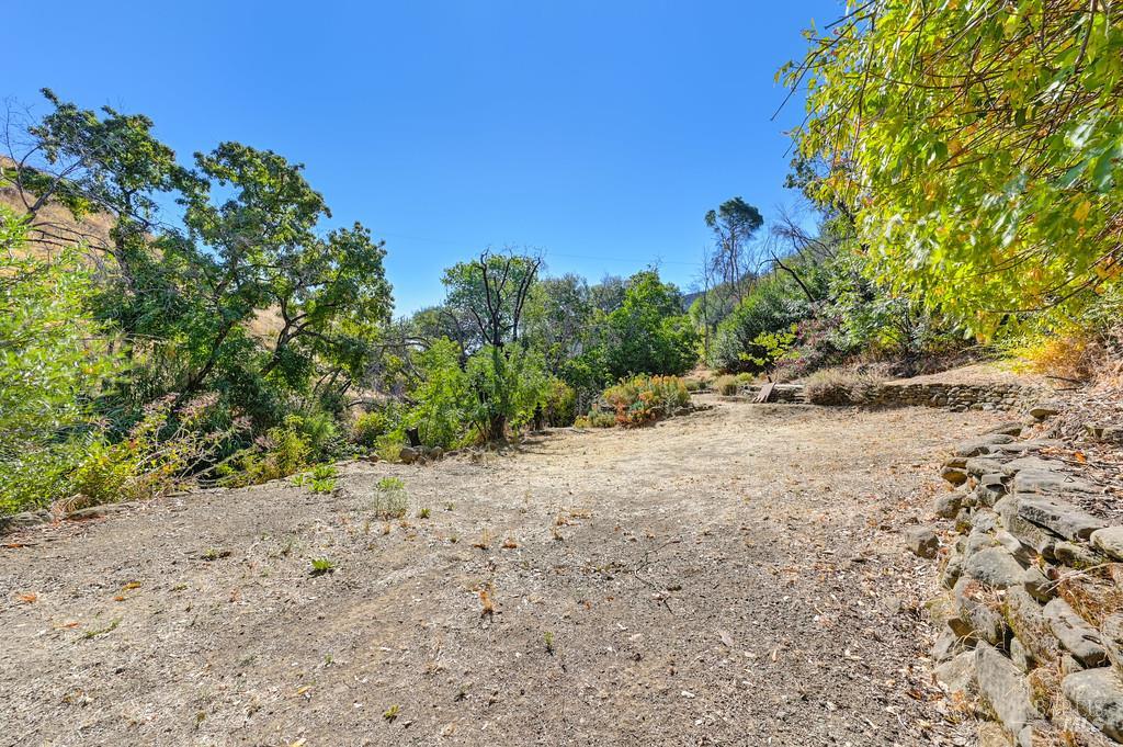 2985 Mix Canyon Road Vacaville, CA 95688 - Photo 15 of 34 a view of a dry yard with trees