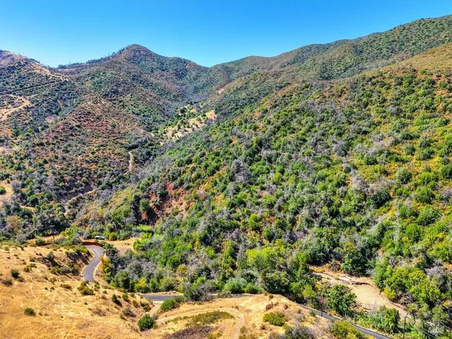 a view of a large building with a mountain in the background