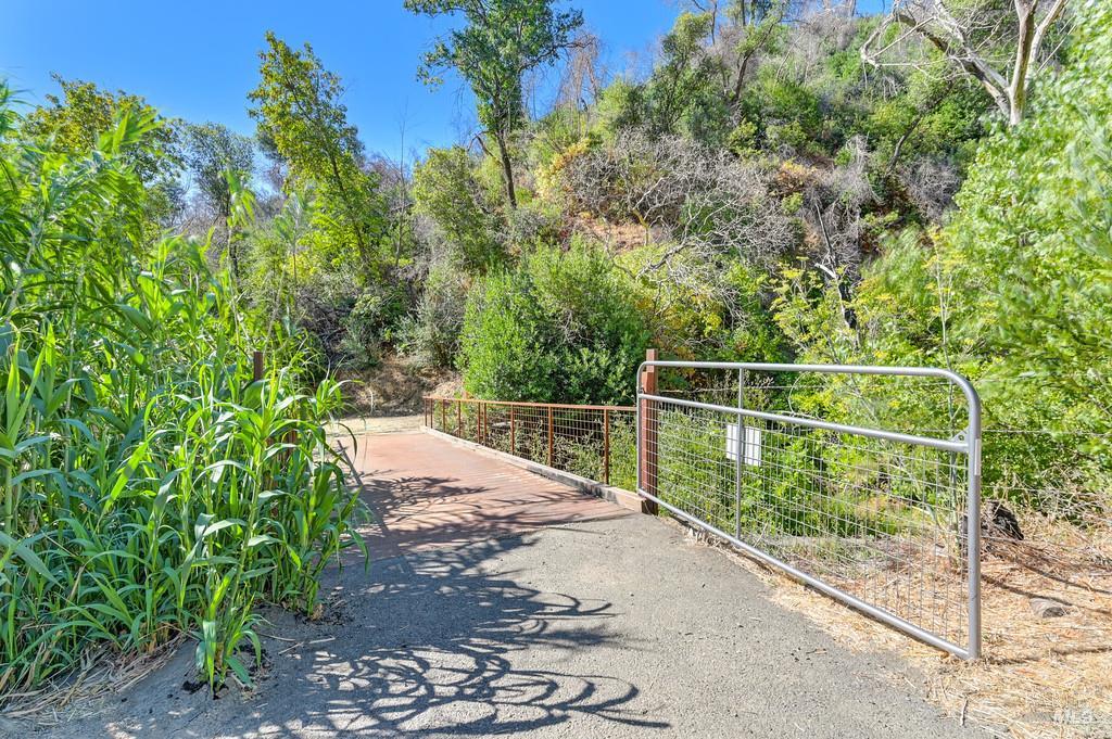 2985 Mix Canyon Road Vacaville, CA 95688 - Photo 6 of 34 a view of a fence with a tree