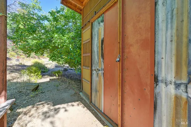a view of a backyard of the house