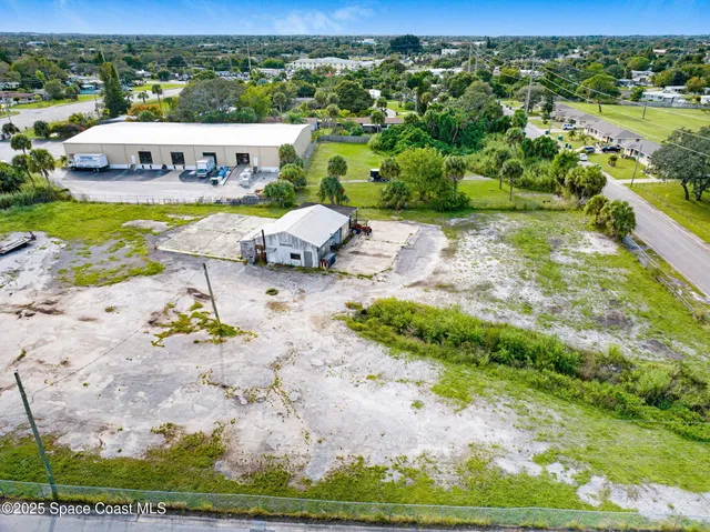 an aerial view of a swimming pool and lake view
