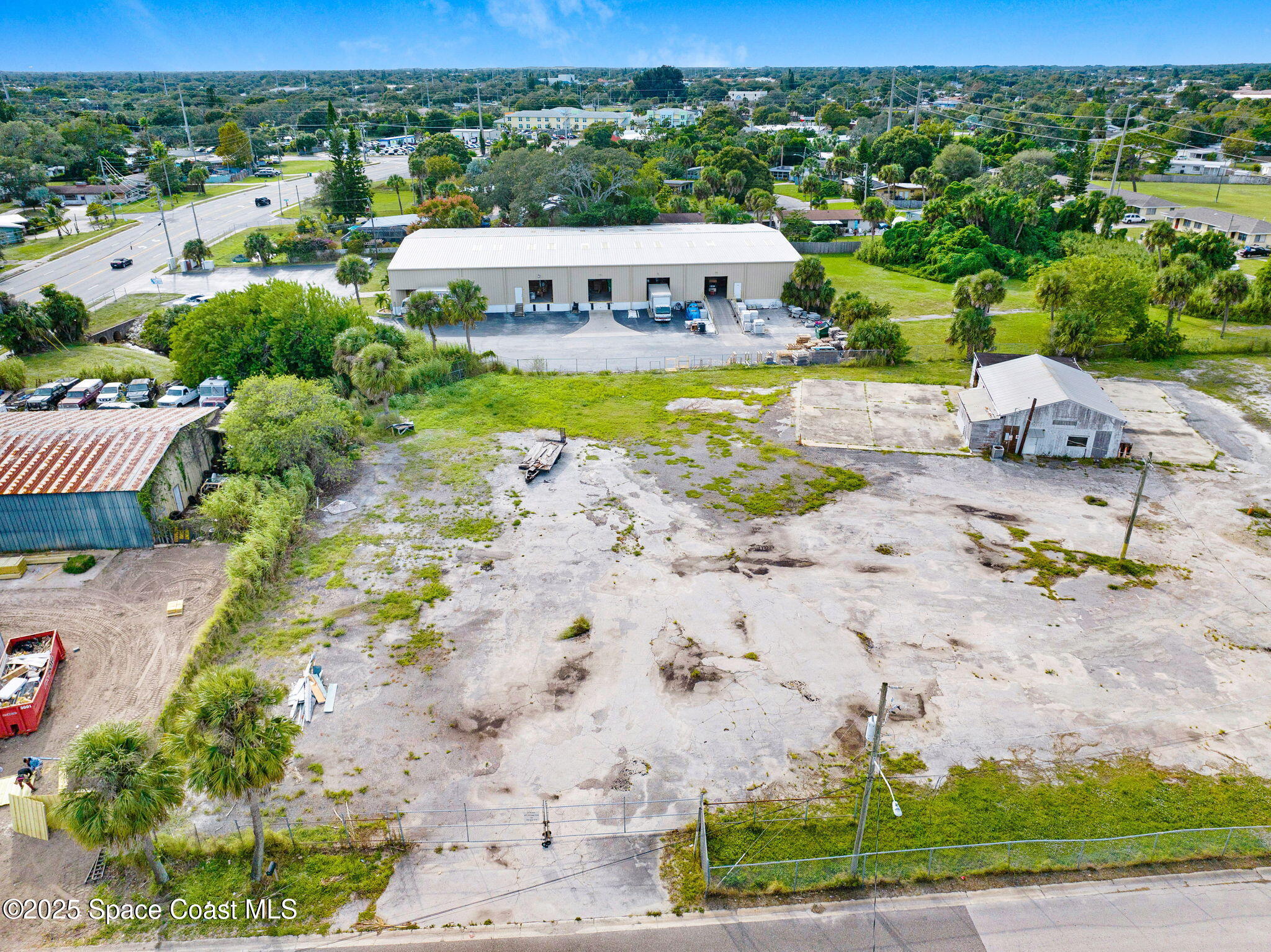 1075 Mcclendon Street Melbourne, FL 32935 - Photo 17 of 24 an aerial view of a swimming pool and lake view