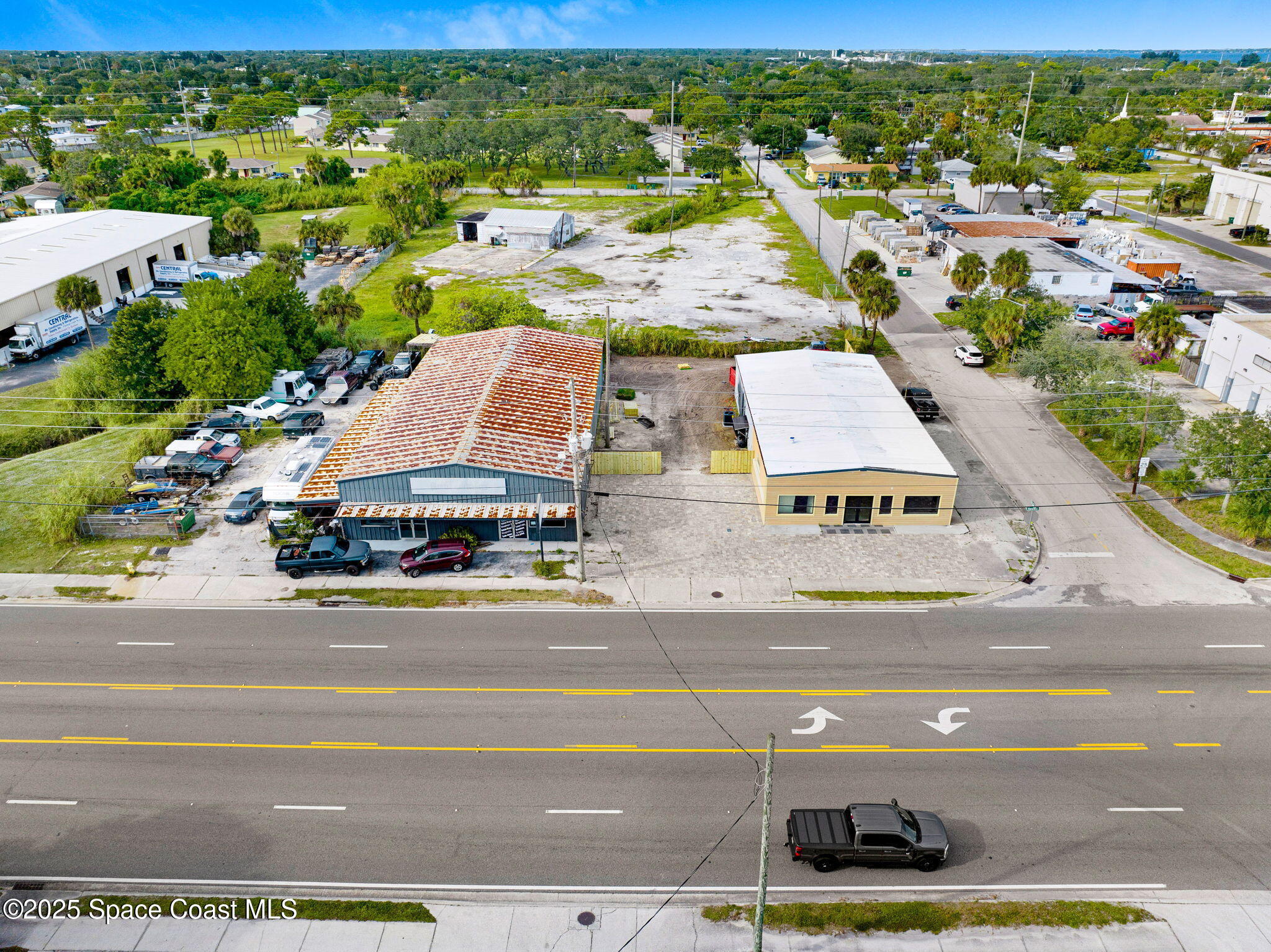 1075 Mcclendon Street Melbourne, FL 32935 - Photo 18 of 23 an aerial view of multiple houses with yard