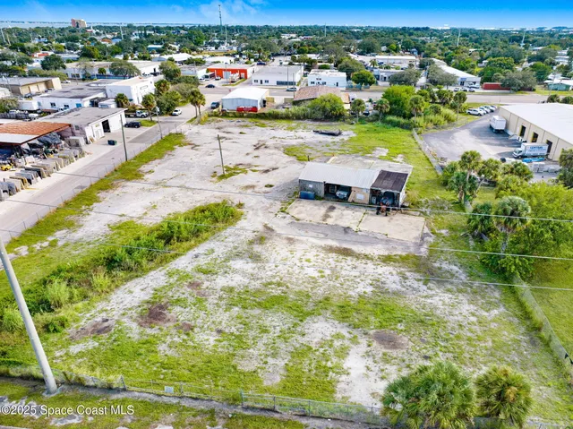 a view of a lake with beach and outdoor space