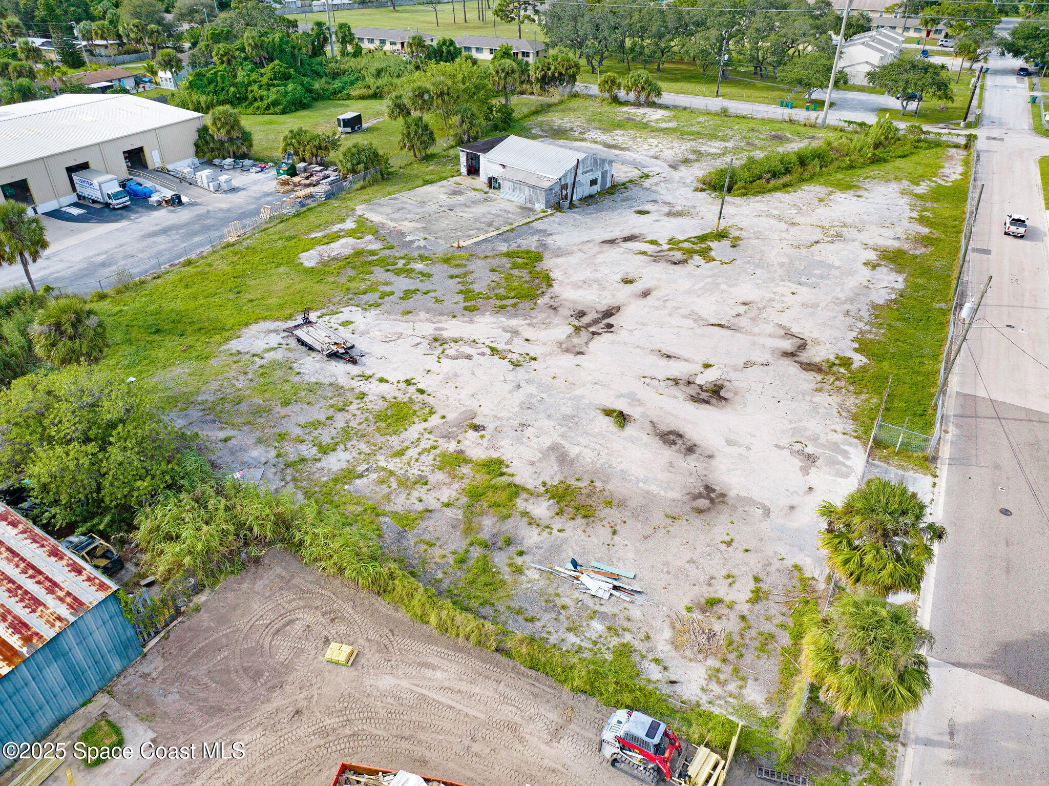 1075 Mcclendon Street Melbourne, FL 32935 - Photo 4 of 24 a view of a lake with beach and outdoor space