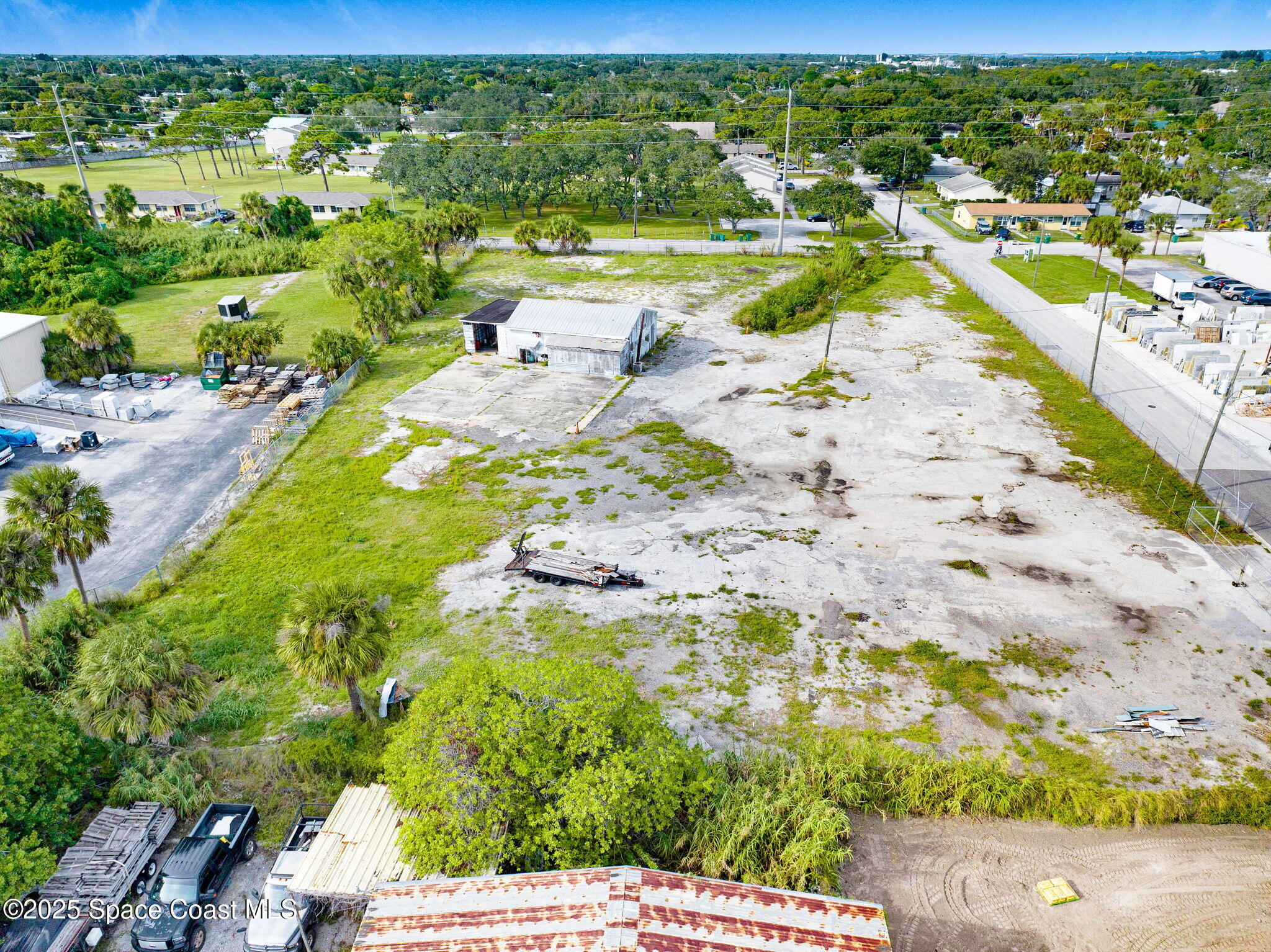1075 Mcclendon Street Melbourne, FL 32935 - Photo 9 of 24 a view of a city with an ocean beach